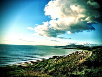 Scenic view of sea against cloudy sky