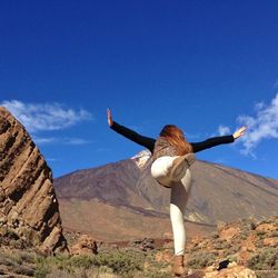 Woman standing on rock