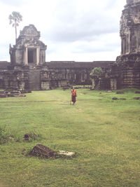 Full length of man outside temple against building