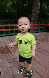 Portrait of cute boy standing outdoors