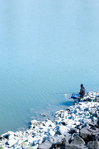 Rear view of man fishing