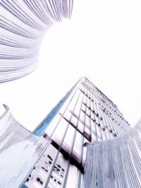 Low angle view of modern buildings against clear sky