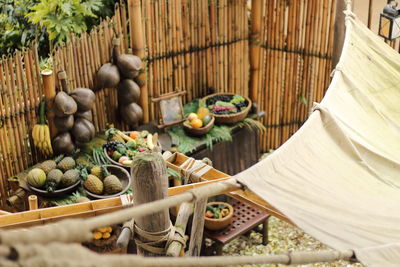 High angle view of food on tables against fence