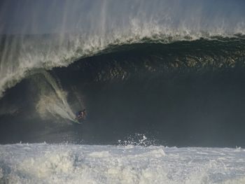 People surfing in sea