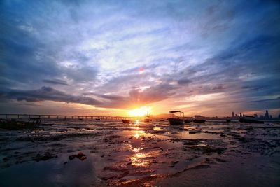 Scenic view of beach at sunset