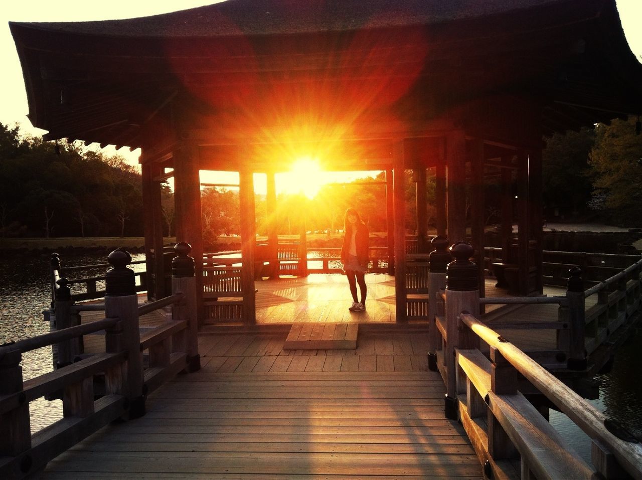 wood - material, pier, sunset, sun, built structure, water, sunlight, chair, architecture, sunbeam, bench, table, wood, empty, sky, lens flare, jetty, the way forward, railing, tranquility