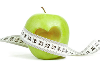 Close-up of apple against white background