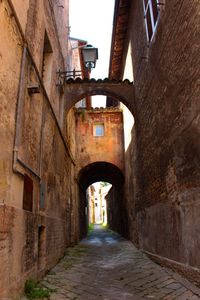 Narrow alley along old buildings