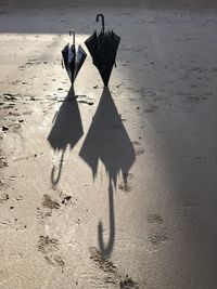 High angle view of shadow on sand at beach
