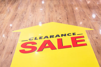 High angle view of information sign on table