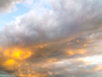 Low angle view of cloudy sky during sunset