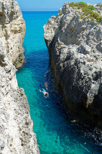 High angle view of rocks at sea shore