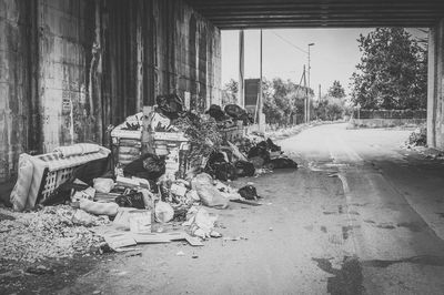 Abandoned cars on street in city