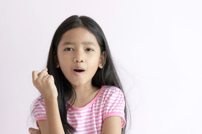 Portrait of a girl over white background