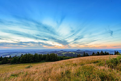 Scenic view of landscape against sky during sunset