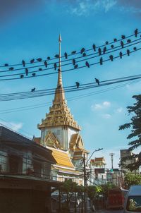 Low angle view of temple against blue sky