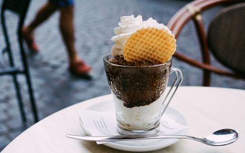 Close-up of ice cream in glass on table