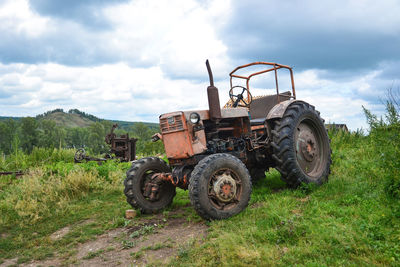 Tractor on field against sky