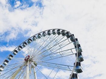 Low angle view of ferris wheel against sky