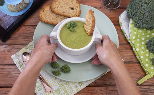 High angle view of person preparing food on table