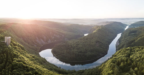 Scenic view of mountains and river against sky