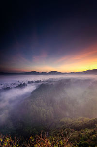 Scenic view of landscape against sky during sunset