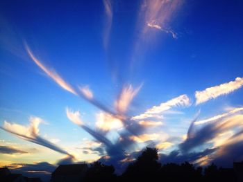 Low angle view of vapor trails in sky