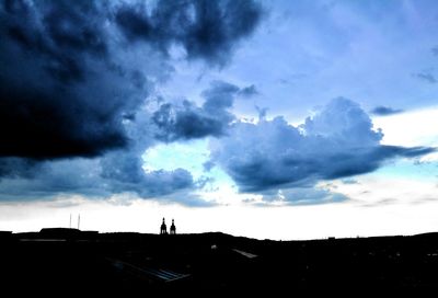 Silhouette man against sky