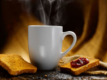 Close-up of coffee cup on table