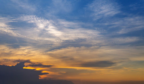 Low angle view of cloudy sky during sunset