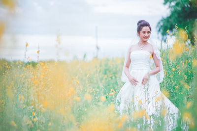 Full length of woman standing on field