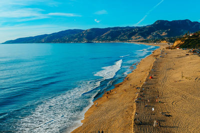 Scenic view of sea against blue sky