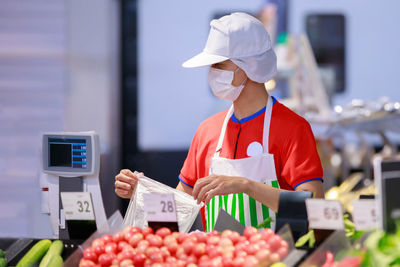 Man working at market stall
