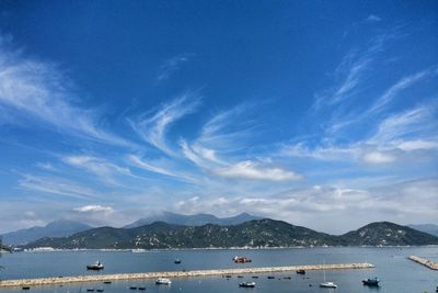 Scenic view of sea against blue sky