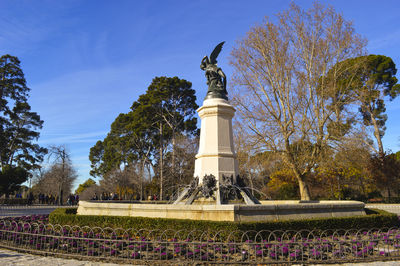 Low angle view of statue against sky