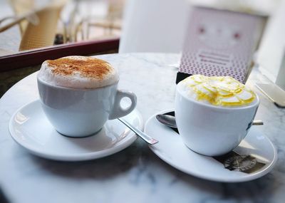 Close-up of coffee and cup on table