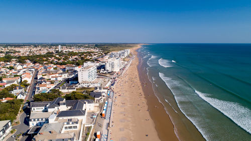 High angle view of sea and buildings against sky