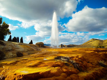 Panoramic view of landscape against cloudy sky