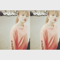 Close-up of girl standing against wall