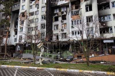 Cities of ukraine after the russian occupation. destroyed buildings on the streets of irpen.