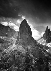 Low angle view of rock formations against sky