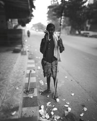 Woman standing on road