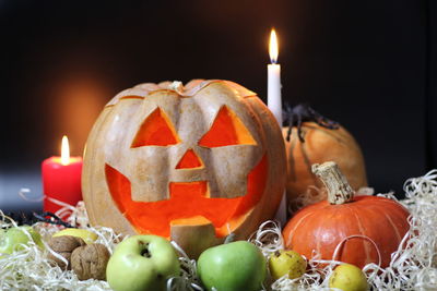 Close-up of illuminated pumpkin against black background