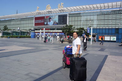Man with luggage at shanghai railway station