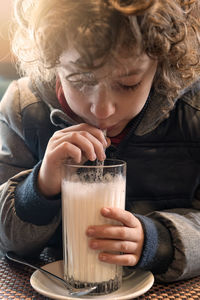 Close-up of boy drinking glass