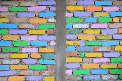 Full frame shot of multi colored brick wall