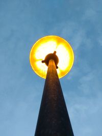 Low angle view of street light against sky