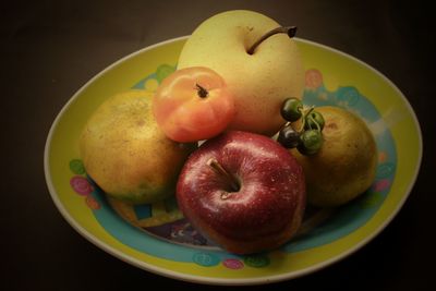 High angle view of apples in plate on table