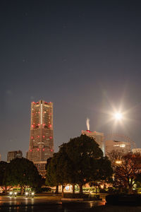 Illuminated buildings in city at night