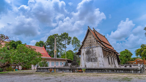 View of temple building against cloudy sky